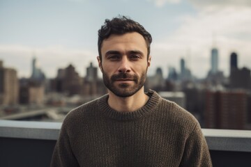 Poster - Portrait of handsome man with beard standing on rooftop in New York