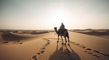 Man Riding A Camel Through A Desert Landscape