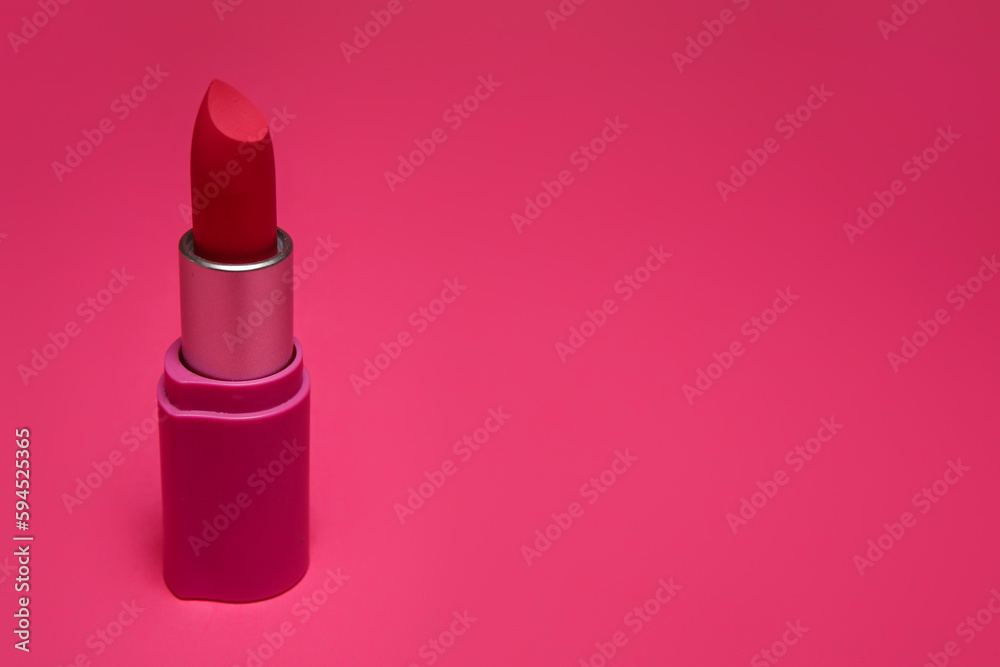 Beautiful lipstick on pink background