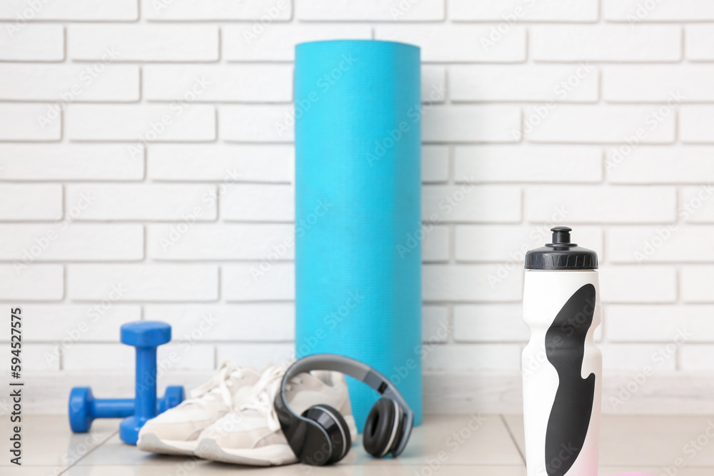 Sports water bottle in gym, closeup