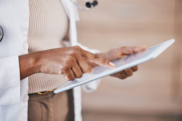 Doctor, woman and hands on tablet for research, Telehealth or healthcare at the hospital. Hand of female medical professional in data analysis or health insurance holding technology at the clinic