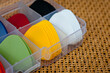 Plastic picks of different colors for playing acoustic or electric guitar.