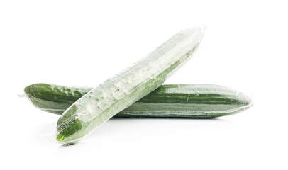 Wall Mural - Fresh green cucumbers wrapped in plastic wrap isolated on white background.