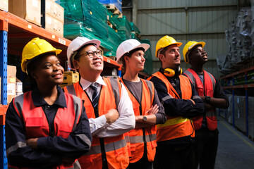 Wall Mural - Group of Industrial workers working at a warehouse factory.