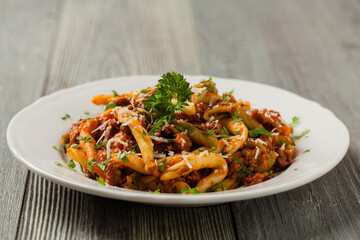 Wall Mural - Maccheroni al ferretto with beef in ragu bolognese. Front view.