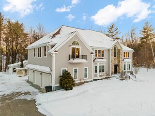 Wintertime view with a residential house, showcasing the exterior in New England