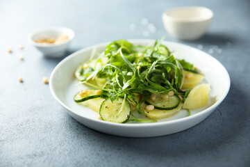 Canvas Print - Potato salad with cucumber and arugula