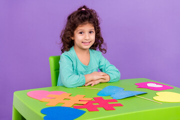 Wall Mural - Photo photo of funky sweet small kid wear turquoise shirt sitting enjoying handmade isolated violet color background