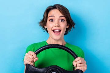 Sticker - Closeup photo of young excited emotion girl young age rent automobile insurance fast speed steering wheel isolated on aquamarine color background