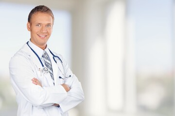 Wall Mural - Portrait of happy doctor standing at hospital