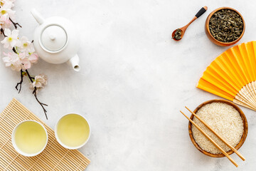 Wall Mural - Asian concept with tea set and rice bowl, top view