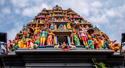 Colorful figures at a landmark Hindu temple in downtown Singapore