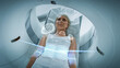 © Gorodenkoff - Female Patient Lying on a CT or PET or MRI Scan, Moving Inside the Machine While it Scans Her Brain and Vital Parameters. AR Concept of Visual Effects In Medical Lab with High-Tech Equipment.
