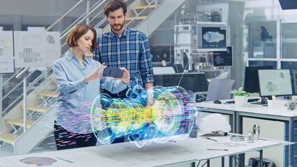 Wall Mural - engineering facility: female designer with lead engineer use smartphone with augmented reality app t