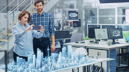 Wall Mural - architect and engineer have discussion and use augmented reality smartphone to design sustainable 3d