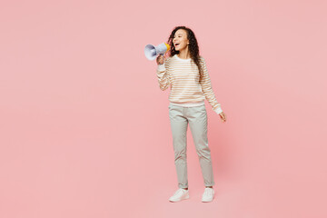 Canvas Print - Full body young woman of African American ethnicity she wearing light casual clothes hold megaphone scream announces discounts sale Hurry up isolated on plain pastel pink background studio portrait.