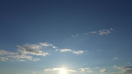 Wall Mural - beautiful peaceful sunny evening sky time lapse. clear sunset blue sky, sun circle shine brightly wi