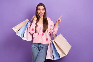 Sticker - Photo of young girl wear stylish cardigan strawberry ornament shock low prices direct finger mockup hold bags isolated on purple color background