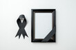 top view picture frame with black bow on white background death funeral