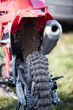 Rear wheel of motorcycle participates in motocross race.