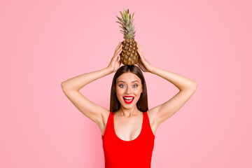 Wall Mural - Emotion facial expressing leisure play people person concept. Close up photo portrait of funky stylish trendy beautiful lovely shocked lady with fresh tasty ananas on head isolated on vivid background