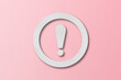© คเณศ จันทร์งาม - White paper punched into the shape of an exclamation mark. warning sign set on pink paper background