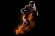 © surassawadee - Silhouette of American football player, player in action on fire. Isolated on black background