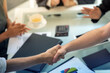 © BESTIMAGE - handshake after partnership meeting success business contract deal. Teamwork congratulate Handshaking for good deal contract agreement partner sign contract paper trust team.