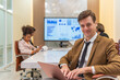 © StockPhotoRepublic - Young handsome successful businessman with different poses in a meeting room. Team lead in a meeting room. Manager at work.