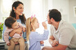 © Azeemud-Deen Jacobs/peopleimages.com - Easter, creative and happy with family and face painting for celebration, holiday and bonding. Art, color and party with children and parents with bunny ears at home for happiness, vacation or relax