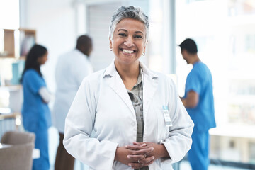 Wall Mural - Senior doctor, woman and smile in clinic portrait for inspection, excited and vision for expert. Female medic, leadership and management with confidence, success and happy for career goal at hospital