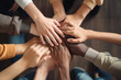 © PETR BABKIN - a group of people holding hands together in a circle. Generative Ai