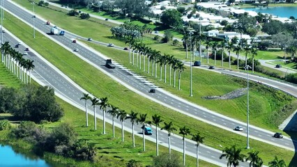 Wall Mural - Aerial view of busy american highway with fast moving traffic. Interstate transportation concept