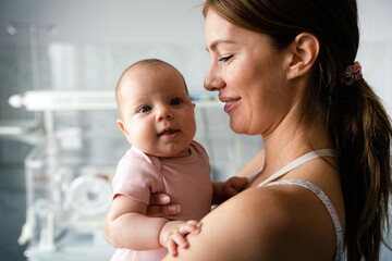 Poster - Baby and mother in hospital. New life concept.