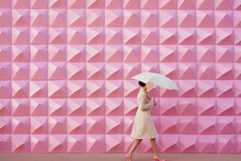 Pop Minimal Scene Of A Woman With Umbrella In A Geometric Pop Background Wall Lines, Pink Mood, Generative Ai Illustration