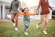 © Clayton Daniels/peopleimages.com - Child, new home and parents playing in portrait and outside for house bonding together on lawn or grass feeling excited. Holding hands, mother and father with little girl, kid or daughter having fun