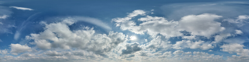 Wall Mural - hdri 360 panorama of blue sky with sun and cumulus clouds with zenith in spherical equirectangular projection may use for sky dome replacement in 3d graphics or game development and edit drone shot