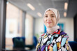 © Johnér - Portrait of smiling businesswoman in hijab