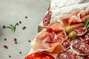 Wall Mural - Italian prosciutto, cured pork meat on cutting board, Spanish tapas wine. Restaurant menu, dieting, cookbook recipe top view