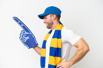 Poster - Young caucasian sports fan man isolated on white background suffering from backache for having made an effort