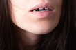 Close up of woman's open mouth with gap teeht. Lips and unusual teeth