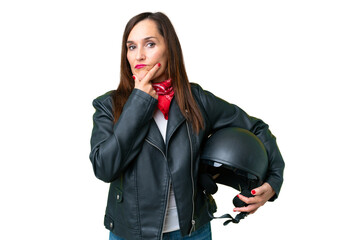 Wall Mural - Middle age caucasian woman with a motorcycle helmet over isolated chroma key background thinking