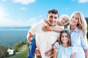 Poster - Happy young family have fun in the garden