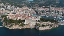 Aerial View Of The Oceanographic Museum In Monaco Ville, South France Ft. Prince Palace On The Rock In Mediterranean Sea And Old Town Around The Famous Port And Marina From Above Of Monte Carlo 4K UHD