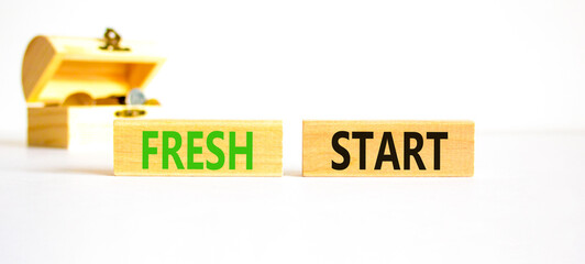 Wall Mural - Fresh start and motivational symbol. Concept words Fresh start on wooden block. Beautiful white table white background. Wooden chest with coins. Business motivational Fresh start concept. Copy space.