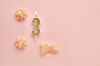 Number 3 on a pastel pink background with festive decorations. Happy birthday candles. The concept of celebrating a birthday, anniversary, important date, holiday. Copy space. banner
