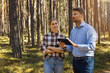 © ronstik - forest appraiser or buyer and owner doing property inspection and valuation