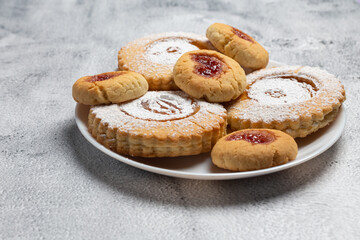 Homemade cookies with jam on a white dish. freshly made tasty cookies. close-up.