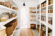 © Trinette Reed - Organized food pantry closet in cozy cottage style home