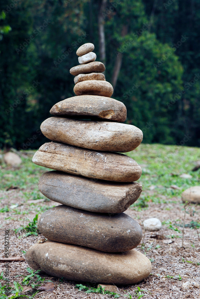 Stacking Rocks Pyramid The pebbles stones are stacked in a pyramid against the natural ...